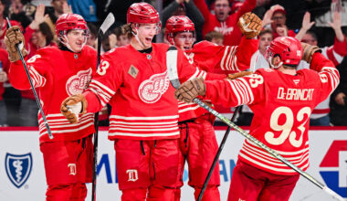 Dec 21, 2025; Detroit, Michigan, USA; Detroit Red Wings defenseman Moritz Seider (53) celebrates his game winning goal with teammates during overtime against the Washington Capitals at Little Caesars Arena. Mandatory Credit: Tim Fuller-Imagn Images