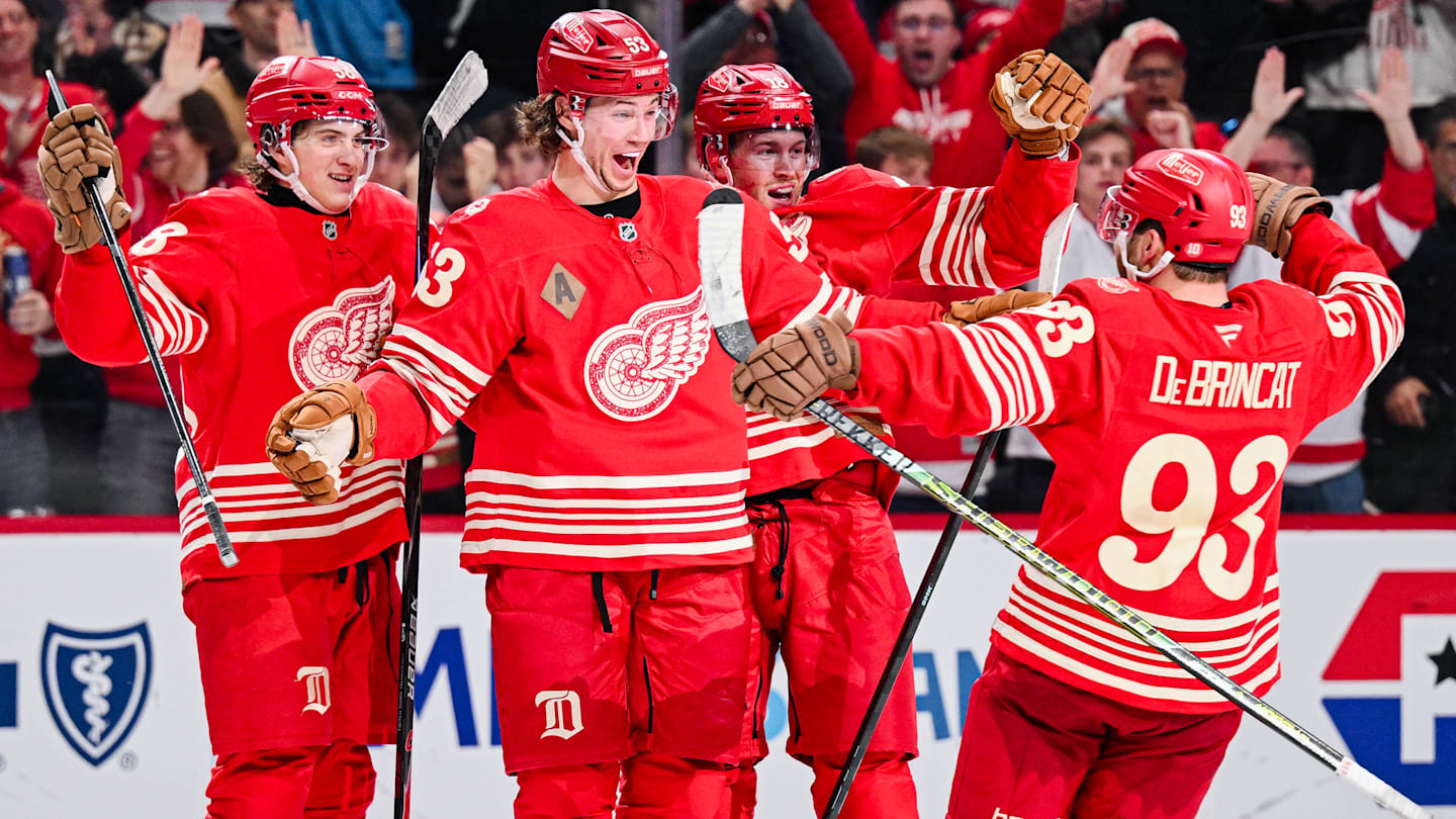 Dec 21, 2025; Detroit, Michigan, USA; Detroit Red Wings defenseman Moritz Seider (53) celebrates his game winning goal with teammates during overtime against the Washington Capitals at Little Caesars Arena. Mandatory Credit: Tim Fuller-Imagn Images