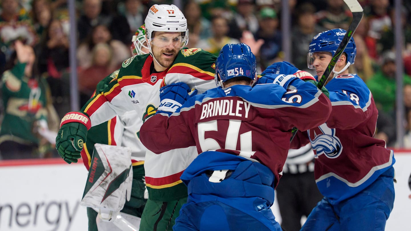 Dec 21, 2025; Saint Paul, Minnesota, USA; Colorado Avalanche center Gavin Brindley (54) and Minnesota Wild left wing Marcus Foligno (17) fight in the second period at Grand Casino Arena. Mandatory Credit: Matt Blewett-Imagn Images
