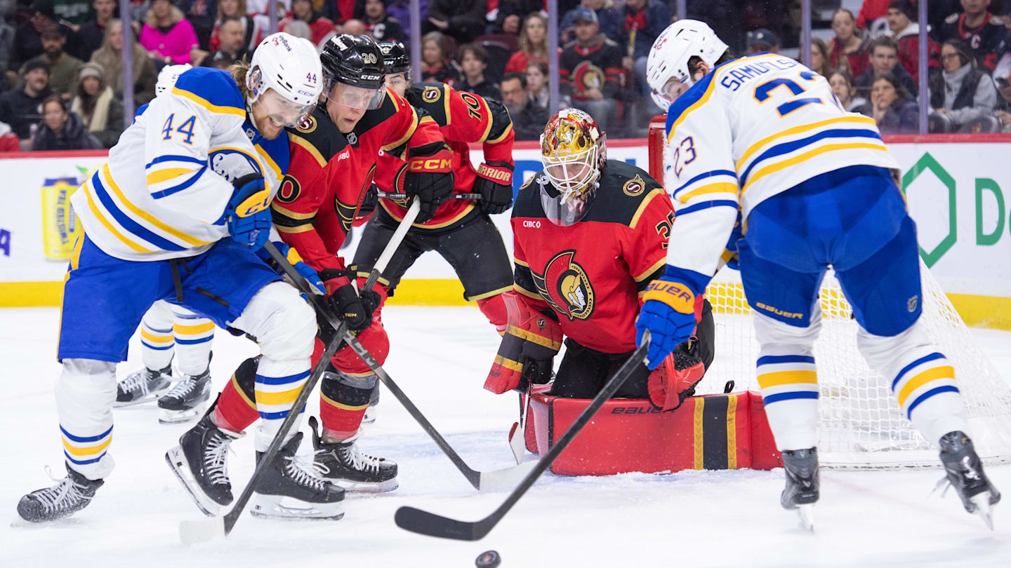 Dec 23, 2025; Ottawa, Ontario, CAN; Buffalo Sabres center Josh Dunne (44) battles with Ottawa Senators left wing Fabian Zetterlund (20) as Sabres defenseman Mattias Samuelsson (23) settles the puck in the second period at the Canadian Tire Centre. Mandatory Credit: Marc DesRosiers-IMAGN Images
