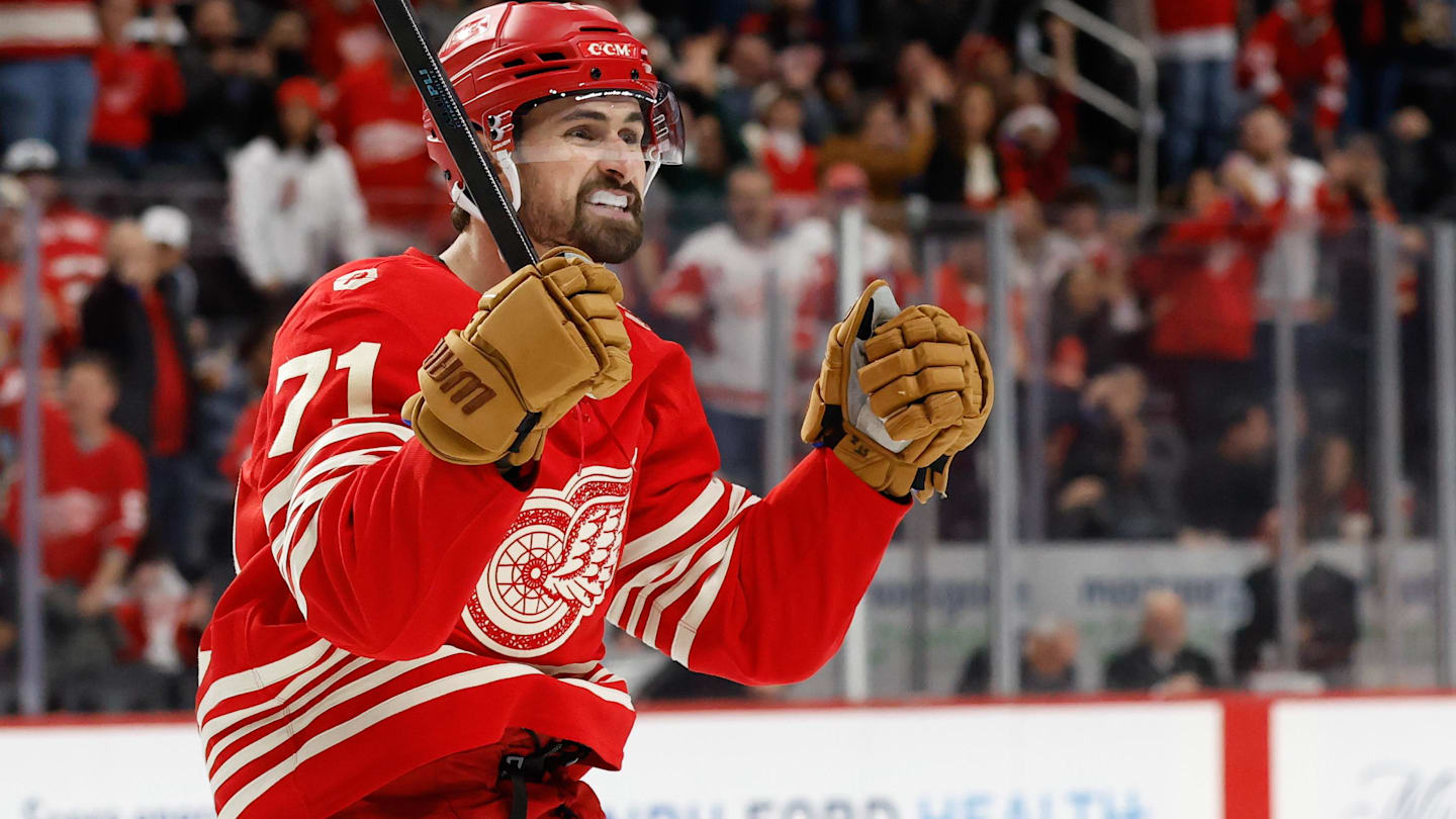 Dec 2, 2025; Detroit, Michigan, USA;  Detroit Red Wings center Dylan Larkin (71) celebrates a goal by defenseman Ben Chiarot (not pictured) in the second period against the Boston Bruins at Little Caesars Arena. Mandatory Credit: Rick Osentoski-Imagn Images