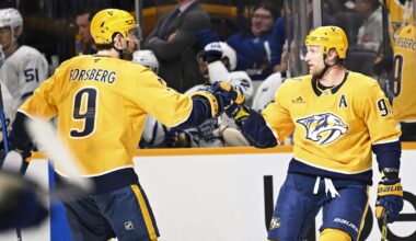Dec 20, 2025; Nashville, Tennessee, USA;  Nashville Predators center Steven Stamkos (91) celebrates a goal with left wing Filip Forsberg (9) against the Toronto Maple Leafs during the third period at Bridgestone Arena. Mandatory Credit: Steve Roberts-Imagn Images