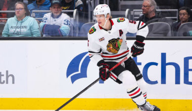Nov 3, 2025; Seattle, Washington, USA; Chicago Blackhawks defenseman Connor Murphy (5) controls the puck in the second period against the Seattle Kraken at Climate Pledge Arena. Mandatory Credit: Kevin Ng-Imagn Images