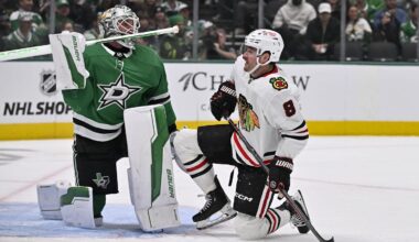 Nov 7, 2024; Dallas, Texas, USA; Dallas Stars goaltender Jake Oettinger (29) and Chicago Blackhawks center Ryan Donato (8) get up off the ice during the third period at the American Airlines Center. Mandatory Credit: Jerome Miron-Imagn Images