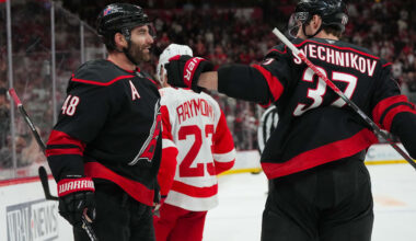 Dec 27, 2025; Raleigh, North Carolina, USA;  Carolina Hurricanes left wing Jordan Martinook (48) celebrates his empty net goal with right wing Andrei Svechnikov (37) against the Detroit Red Wings during the third period at Lenovo Center. Mandatory Credit: James Guillory-Imagn Images