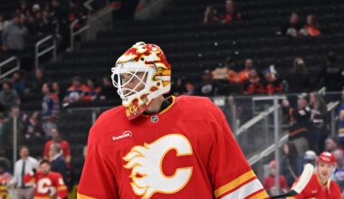 Dec 23, 2025; Edmonton, Alberta, CAN; Calgary Flames goalie Devin Cooley (1) is seen out on the ice during the pre game warm up as the Edmonton Oilers take on the Calgary Flames before the first period at Rogers Place. Mandatory Credit: Walter Tychnowicz-Imagn Images