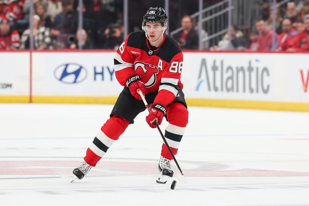 NEWARK, NEW JERSEY - NOVEMBER 08: Jack Hughes #86 of the New Jersey Devils skates with the puck during the second period of a NHL game against the Pittsburgh Penguins at Prudential Center on November 8, 2025 in Newark, New Jersey. (Photo by Andrew Mordzynski/Getty Images)