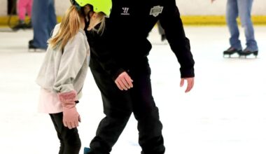 KINGS FOR A DAY—A member of the club works with a young skating hopeful. Courtesy of Katherine Stayer/L.A. Kings