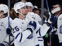 Brandon Carlo of the Toronto Maple Leafs is acknowledged by fans during the first period against the Boston Bruins.