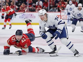 Bobby McMann of the Toronto Maple Leafs skates past Gustav Forsling of the Florida Panthers during Tuesday's game.