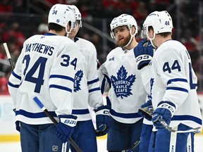 Toronto Maple Leafs' Auston Matthews, William Nylander and Morgan Rielly talk before an unsuccessful power play against the Washington Capitals.