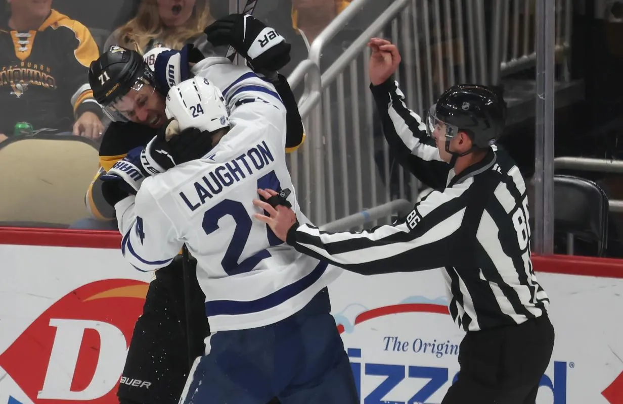 Leafs' Scott Laughton goes after Pens' Evgeni Malkin for attempting to clip him in the head