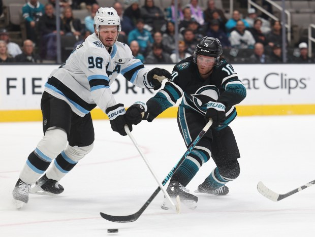 San Jose Sharks forward Ty Dellandrea (10) works the puck...