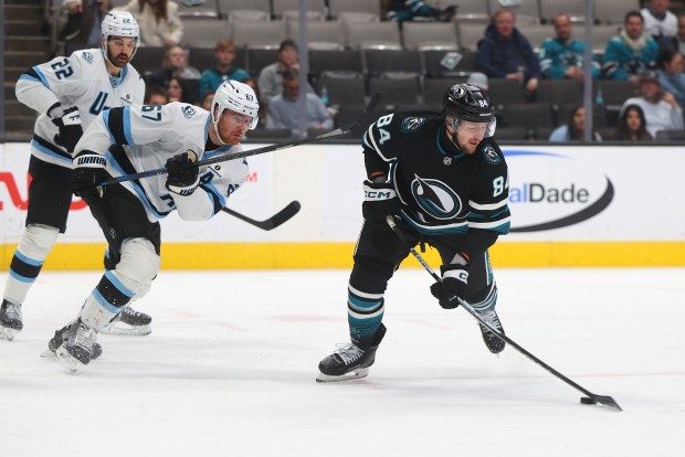 San Jose Sharks forward Pavol Regenda (84) shoots the puck...