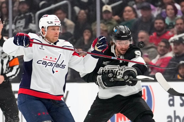 Washington Capitals defenseman Jakob Chychrun, left and Kings right wing...