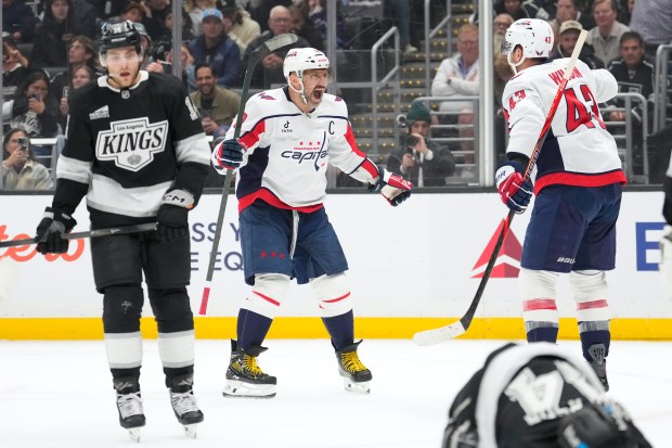 Washington Capitals right wing Tom Wilson, right, celebrates his goal...