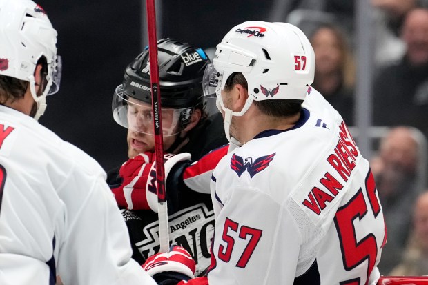 Washington Capitals defenseman Trevor van Riemsdyk, right, scuffles with Kings...