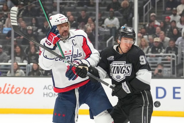 Washington Capitals left wing Alex Ovechkin, left, and Kings left...