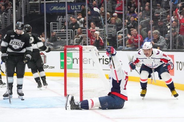 Washington Capitals left wing Anthony Beauvillier, center, celebrates his goal...