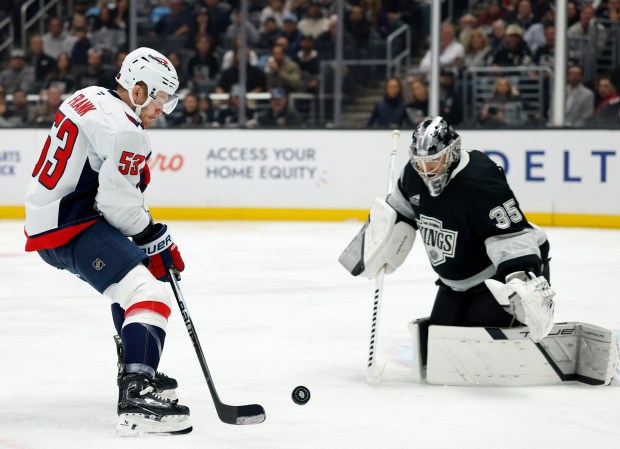 The Washington Capitals’ Ethen Frank attempts a shot as Kings...