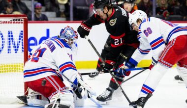 New York Rangers goaltender Igor Shesterkin (31) makes a save on Senators forward Nick Cousins (21) as Rangers blueliner Scott Morrow (60) defends during an NHL game in Ottawa on Dec. 4, 2025. THE CANADIAN PRESS/Spencer Colby