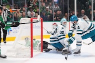 Dallas Stars left wing Jason Robertson (21) scores a goal against San Jose Sharks defenseman...