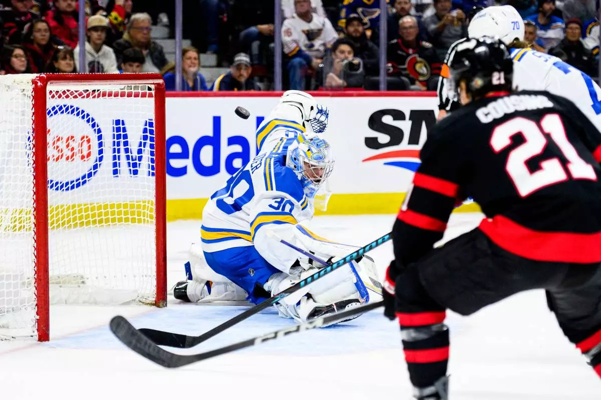St. Louis Blues goaltender Joel Hofer (30) makes a save during second-period NHL hockey game action against the Ottawa Senators in Ottawa, Ontario, Saturday, Dec. 6, 2025. (Spencer Colby/The Canadian Press via AP)