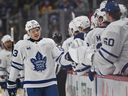 Easton Cowan #53 of the Toronto Maple Leafs celebrates with teammates on the bench after scoring a goal in the first period during the game against the Pittsburgh Penguins at PPG PAINTS Arena on November 29, 2025 in Pittsburgh, Pennsylvania.  