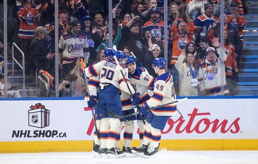 Edmonton Oilers celebrate a goal against the Winnipeg Jets during the first period of an NHL game in Edmonton, Alberta, Saturday, Dec. 6, 2025. (Jason Franson/The Canadian Press via AP)