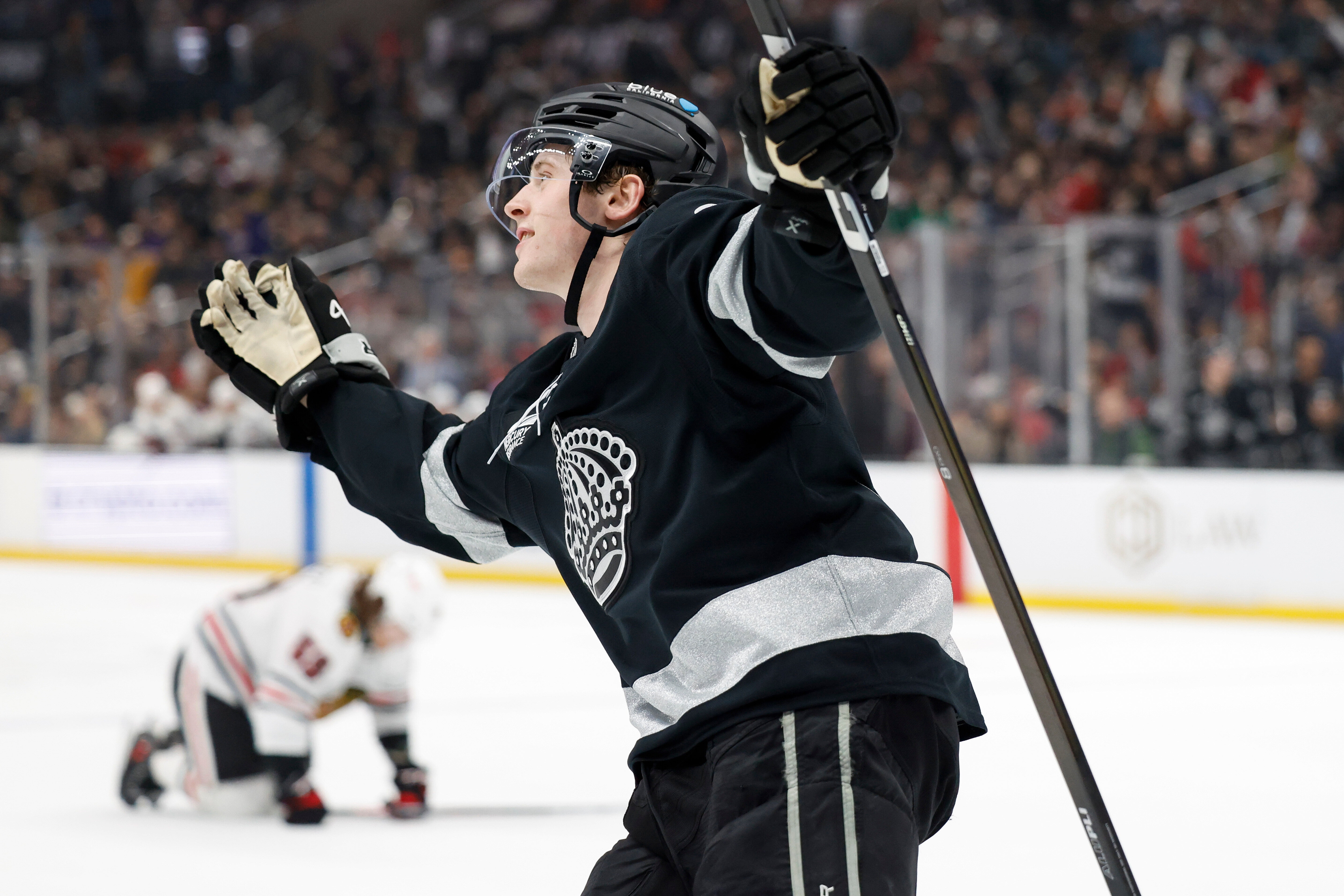 Kings defenseman Brandt Clarke (92) reacts after scoring during the...