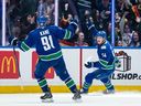 Vancouver Canucks Aatu Raty (54) celebrates his goal against the Minnesota Wild with teammate Evander Kane during second period NHL hockey action in Vancouver on Saturday, Dec. 6, 2025.