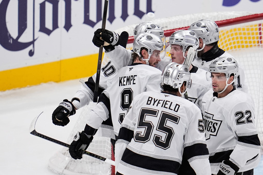 Los Angeles Kings right wing Adrian Kempe (9) celebrates with teammates after scoring a goal during the third period of an NHL hockey game against the San Jose Sharks, Thursday, Nov. 20, 2025, in San Jose, Calif. (AP Photo/Godofredo A. V&aacute;squez)