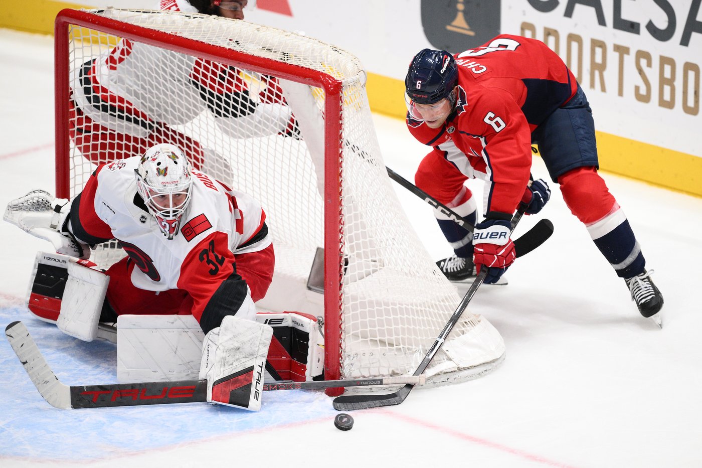 Bussi stops all three in shootout as Hurricanes edge Capitals 3-2 to pull even atop East
