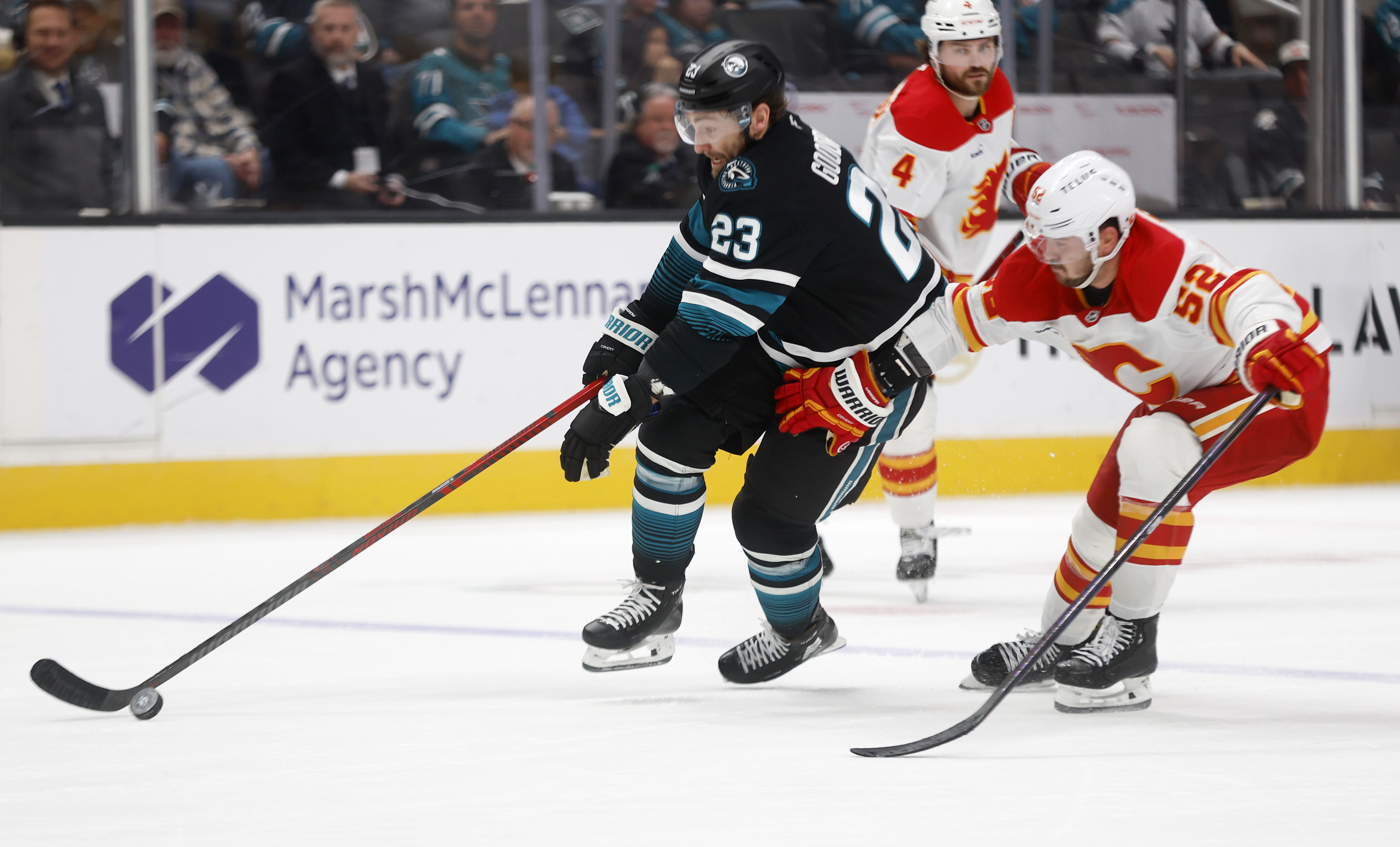 San Jose Sharks' Barclay Goodrow (23) controls the puck against...