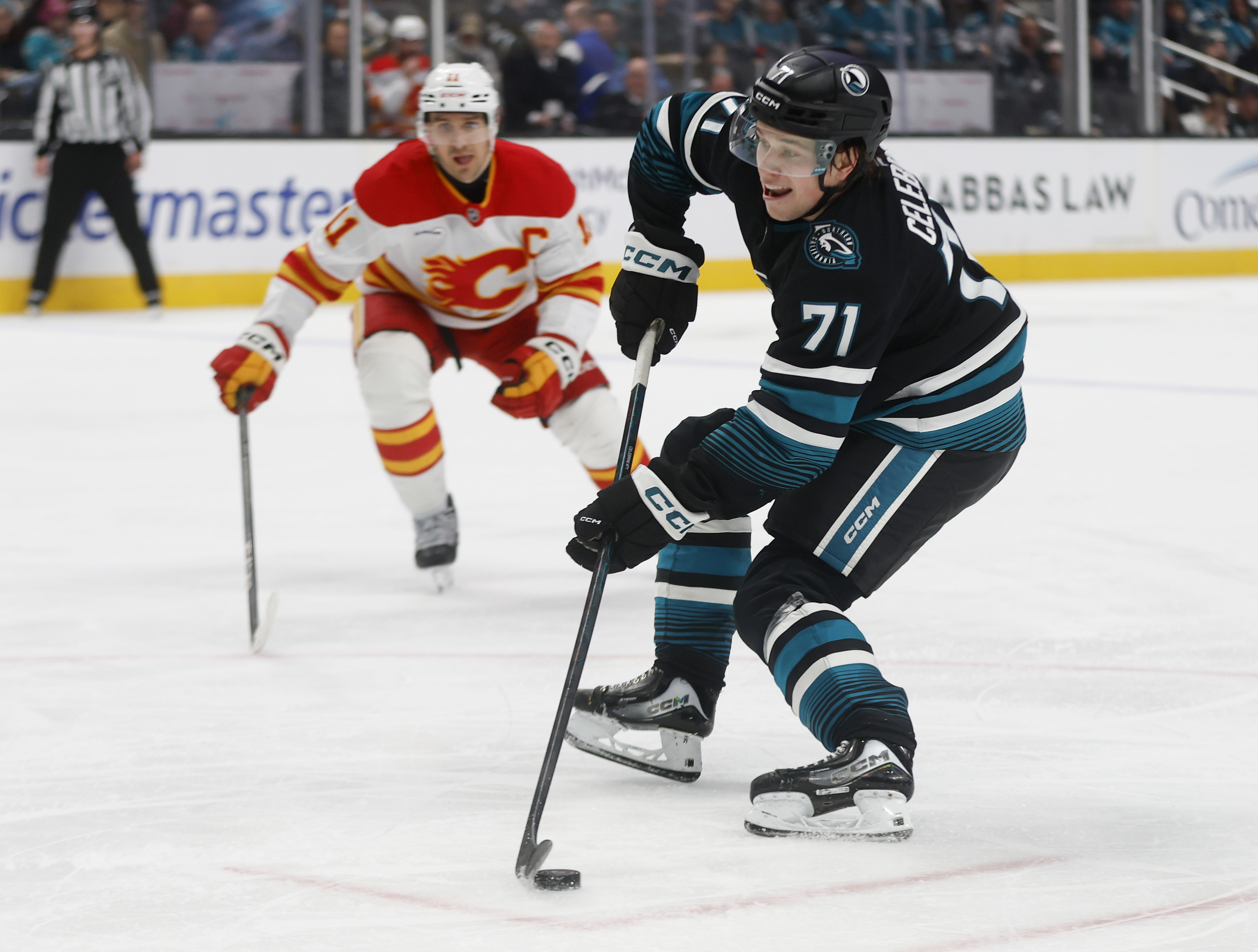 San Jose Sharks' Macklin Celebrini (71) controls the puck against...