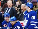 Maple Leafs head coach Craig Berube looks on from the bench with Bobby McMann (74), William Nylander (88) and John Tavares (91).