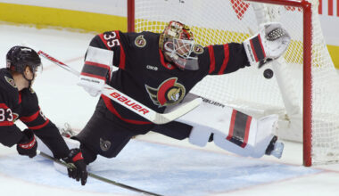 Ottawa Senators goaltender Linus Ullmark (35) reaches for the puck during the first period of an NHL hockey game in Ottawa, Ontario, Thursday, Dec. 18, 2025. (Patrick Doyle/The Canadian Press via AP)