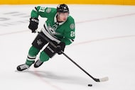 Dallas Stars left wing Jason Robertson skates with the puck during the second period of an...