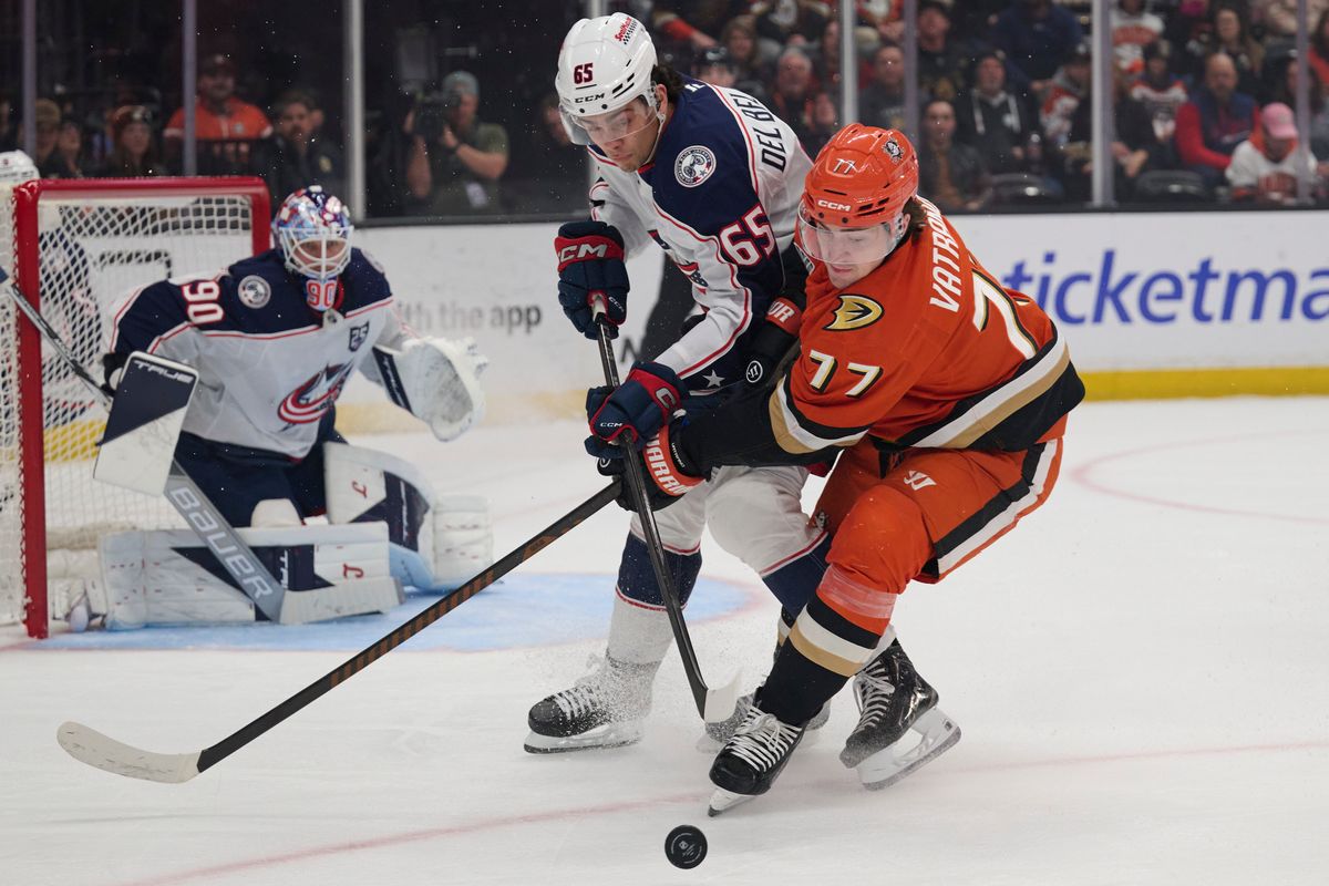 Frank Vatrano #77 of the Anaheim Ducks fights for the puck against the Blue Jackets at the Honda Center on December 20,2025 in Anaheim, California. Frank Vatrano #77 of the Anaheim Ducks fights for the puck against the Blue Jackets at the Honda Center on December 20,2025 in Anaheim, California.