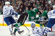 Dec 23, 2014; Dallas, TX, USA; Dallas Stars left wing Jamie Benn (14) is tripped by Toronto...