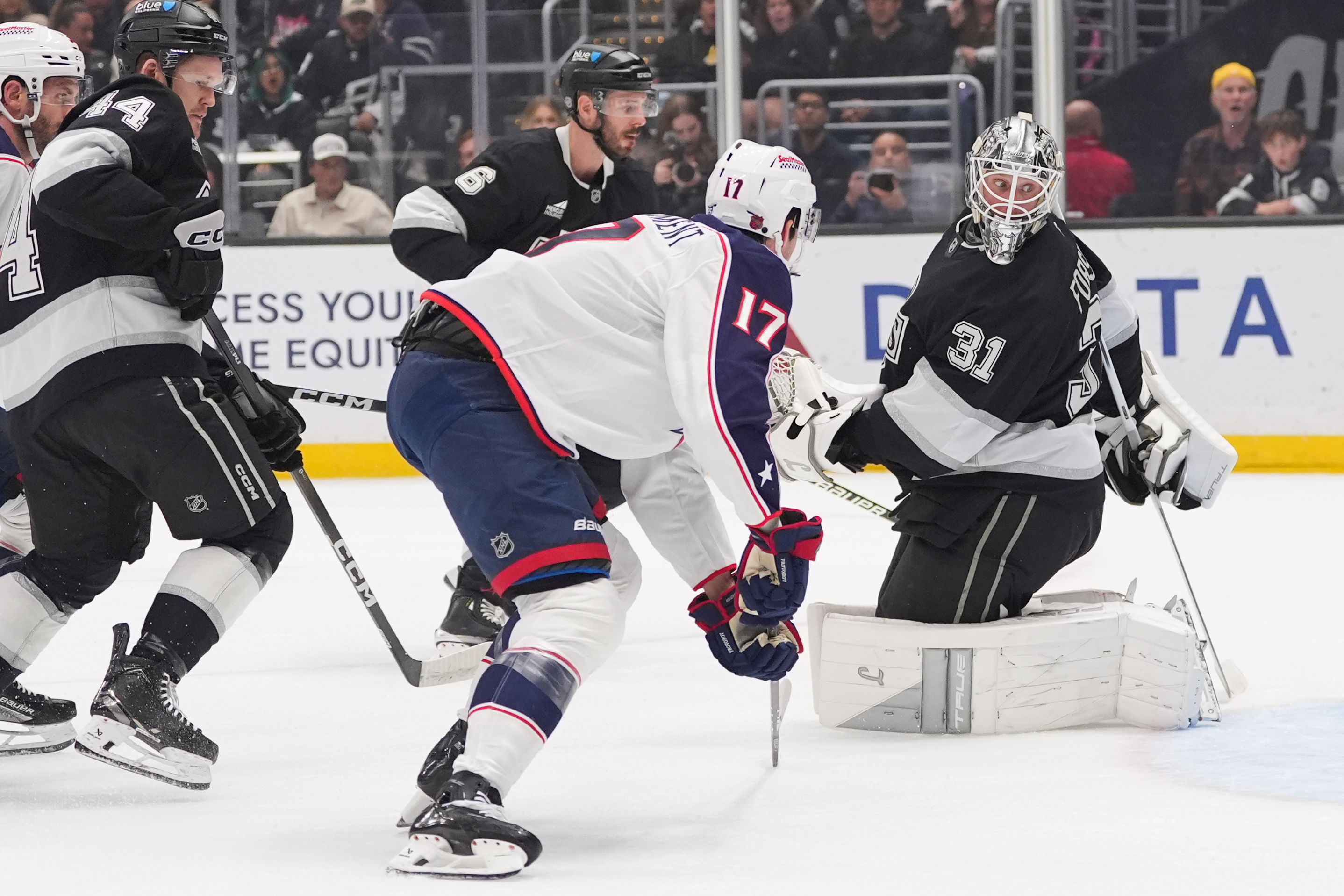 Kings goaltender Anton Forsberg (31) watches as a puck hit...