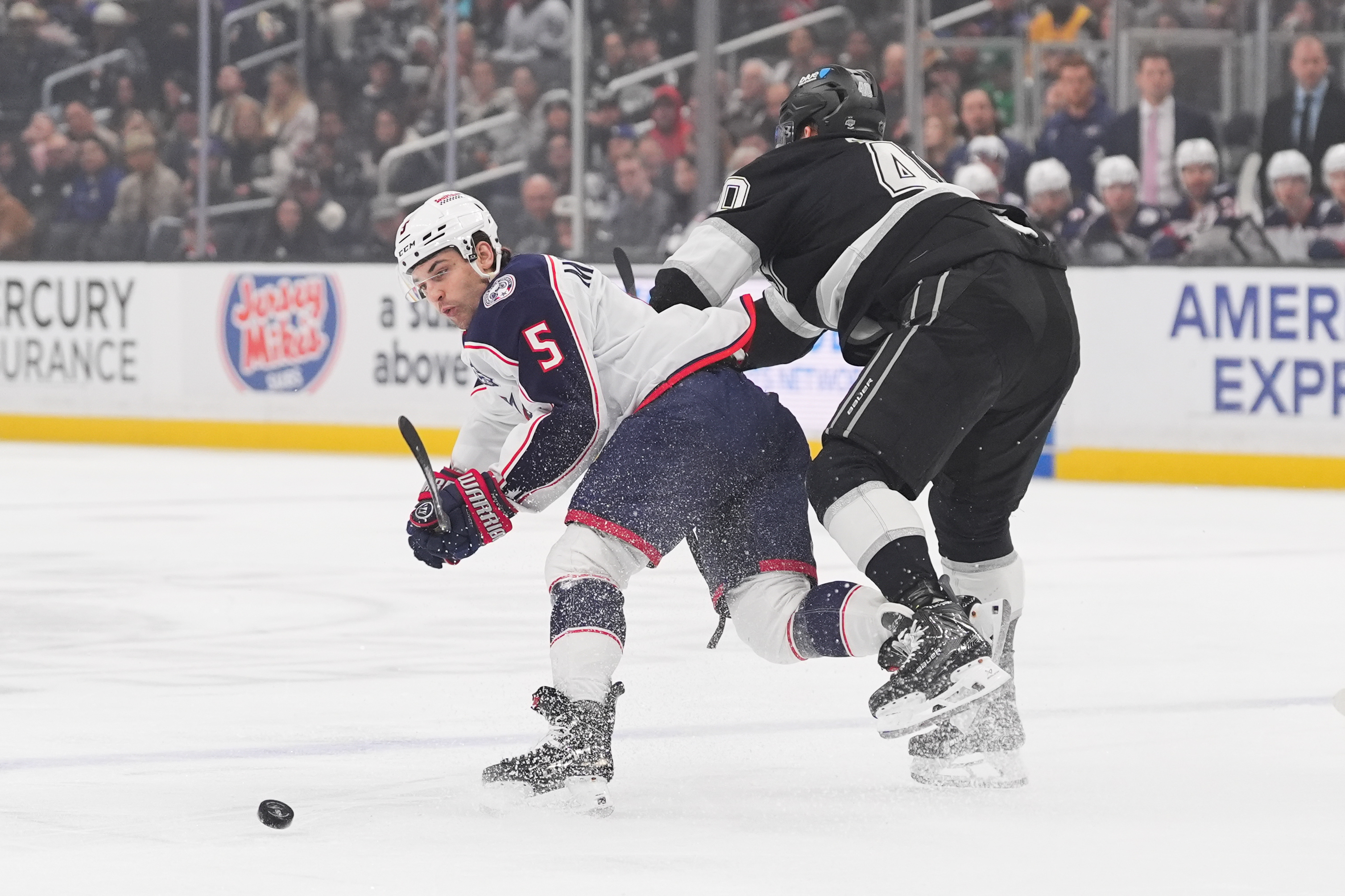 Kings right wing Joel Armia, right, shoves Columbus Blue Jackets...