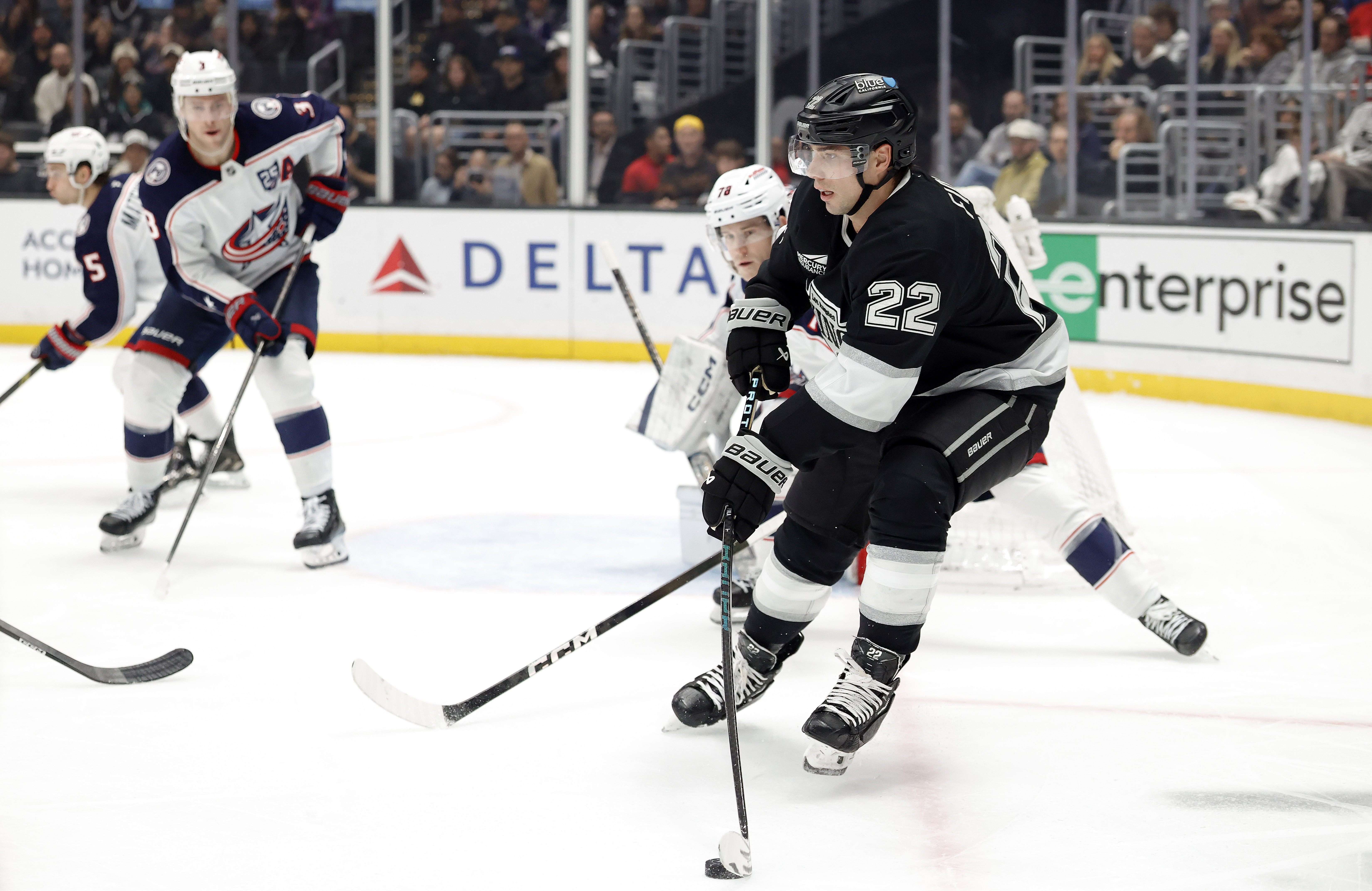 The Kings’ Kevin Fiala, front, skates with the puck during...