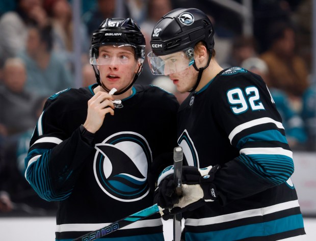 San Jose Sharks' Igor Chernyshov (92) chats with San Jose Sharks' Collin Graf (51) during their game against the Calgary Flames in the third period at the SAP Center in San Jose, Calif., on Tuesday, Dec. 16, 2025. (Nhat V. Meyer/Bay Area News Group)