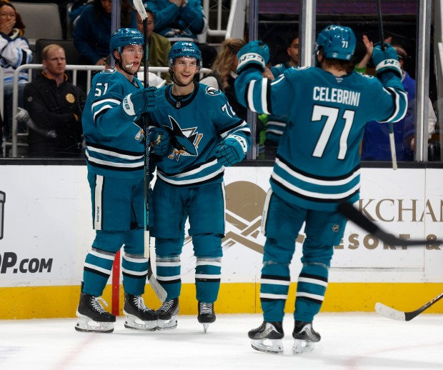 San Jose Sharks' Collin Graf (51) celebrates his goal with San Jose Sharks' William Eklund (72) and San Jose Sharks' Macklin Celebrini (71) against the Boston Bruins in the third period at the SAP Center in San Jose, Calif., on Sunday, Nov. 23, 2025. (Nhat V. Meyer/Bay Area News Group)