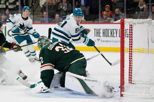 San Jose Sharks right wing Collin Graf (51) shoots and scores the game-winning goal past Minnesota Wild goaltender Filip Gustavsson (32) during overtime of an NHL hockey game, Tuesday, Nov. 11, 2025, in St. Paul, Minn. (AP Photo/Abbie Parr)