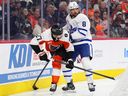 Toronto Maple Leafs' Chris Tanev pressures Philadelphia Flyers' Noah Cates behind the net during a game in November. 