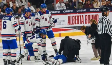 Scary moment at World Juniors as Lane Hutson's brother Cole stretchered off after puck to the head