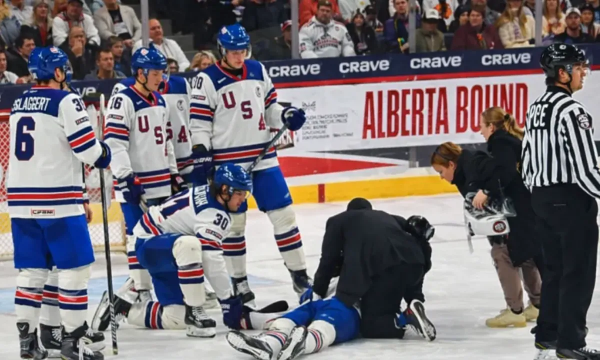 Scary moment at World Juniors as Lane Hutson's brother Cole stretchered off after puck to the head