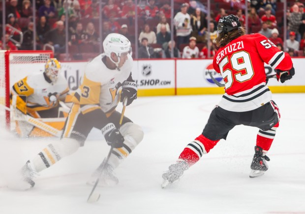 Blackhawks left wing Tyler Bertuzzi (59) drives the net and scores past Pittsburgh Penguins defenseman Jack St. Ivany (3) in the last few seconds of the third period, Dec. 28, 2025, at the United Center. (Dominic Di Palermo/Chicago Tribune)